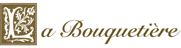 The image features the logo of "La Bouquetiere." It consists of a decorative floral design forming the letter "L" in a brown square, followed by the text "La Bouquetiere" in elegant brown script on a white background.
