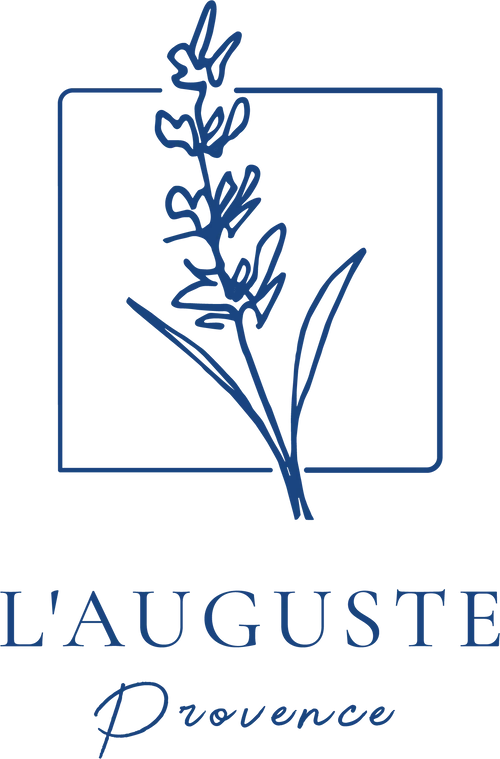 Blue logo featuring a lavender sprig within a square, with text "L'AUGUSTE" below, followed by a signature-style script.