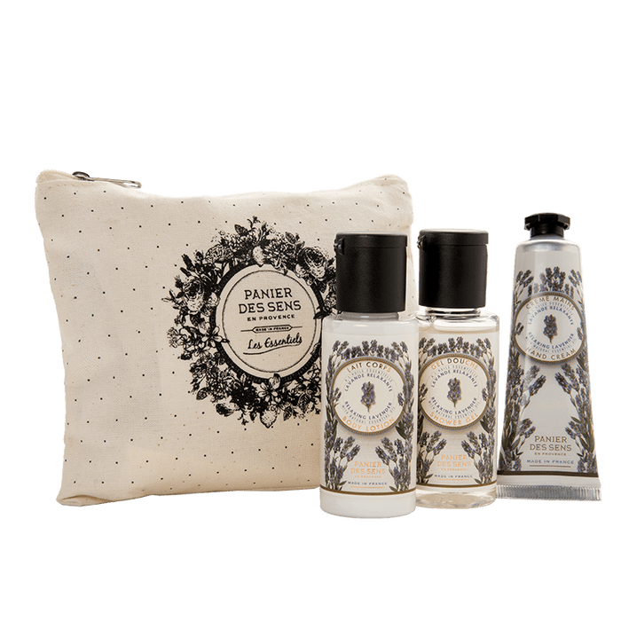 A toiletry set featuring a small beige pouch with a floral design, accompanied by two small bottles and a tube, all labeled "Panier Des Sens" with lavender illustrations.