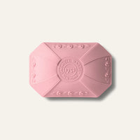 Caswell-Massey Rose Luxury Bar Soap 100g is a pink, rectangular soap with beveled corners and embossed patterns, featuring a central “CASWELL-MASSEY 1752 NEW YORK” emblem—cruelty-free for an elegant cleansing experience.