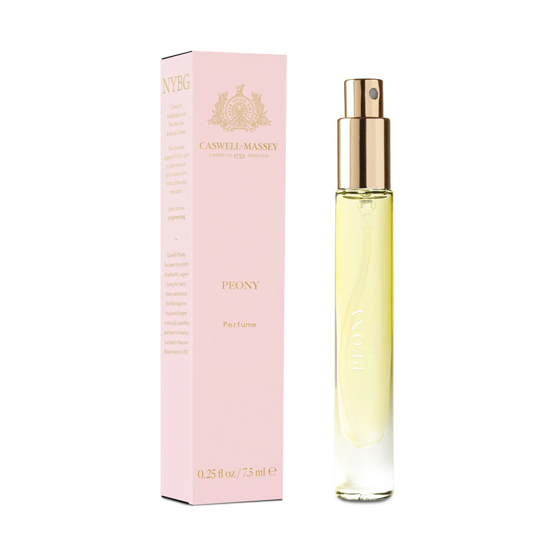 A slender bottle of Caswell Massey Peony Perfume - 7ml alongside its pink packaging box. The bottle features a gold spray nozzle and contains light yellow colored sweet amber floral perfume.
