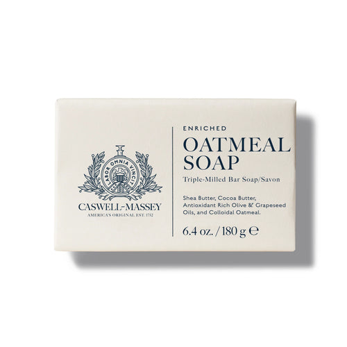 A rectangular white box of Caswell-Massey Oatmeal Bar Soap displays the brand crest, product name, and info on its moisturizing formula with colloidal oatmeal; weight is 6.4 oz (180 g), all printed on the front.