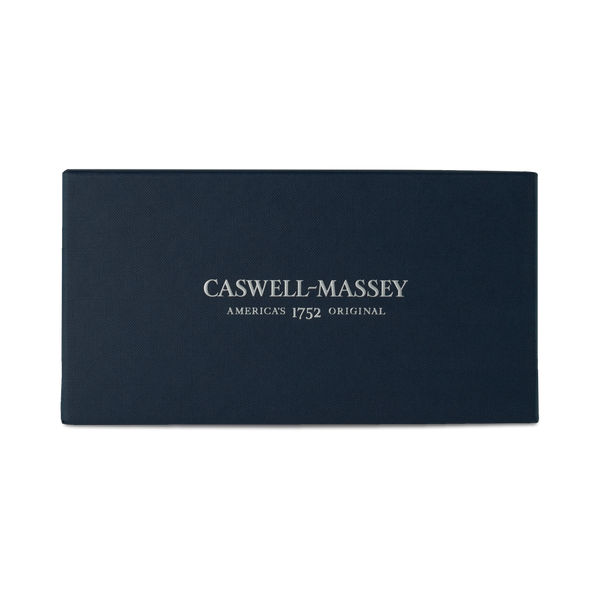 The Caswell Massey Blue Logo Gift Box for Oval Bar Soaps is a rectangular dark blue box with "America's 1752 Original" in white, ideal for gifting or adding elegance to any Caswell Massey personalized soap set.
