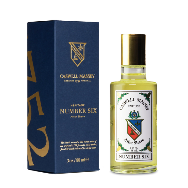 A bottle of Caswell-Massey Number Six Aftershave sits beside its sleek box.