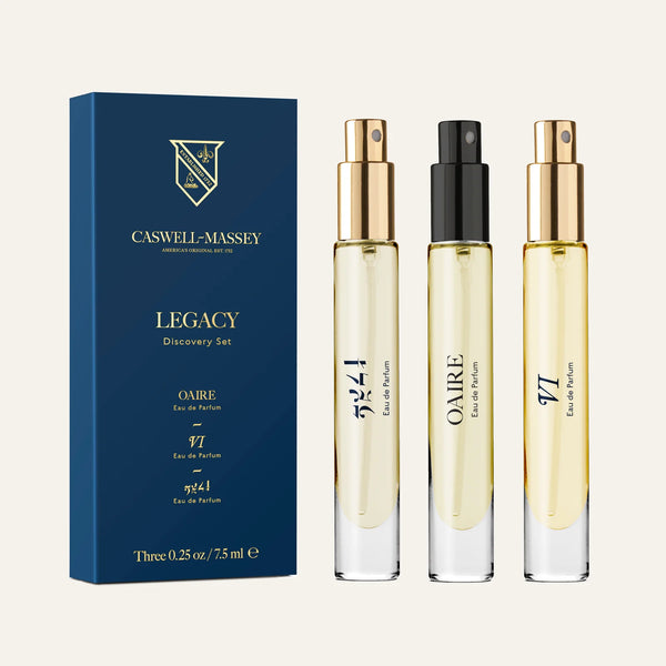The Caswell-Massey Legacy Discovery Set includes three premium signature fragrances—OAÏRE, 524, and 97—in glass spray bottles with gold caps, all presented in a blue box.