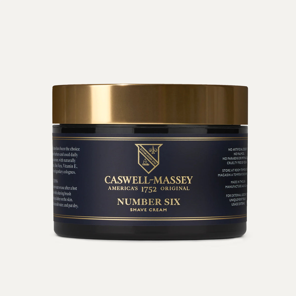 A black and gold jar of Caswell Massey Number Six Shave Cream with a gold lid, showing the brand’s logo and product details on the label of this hydrating shave cream.