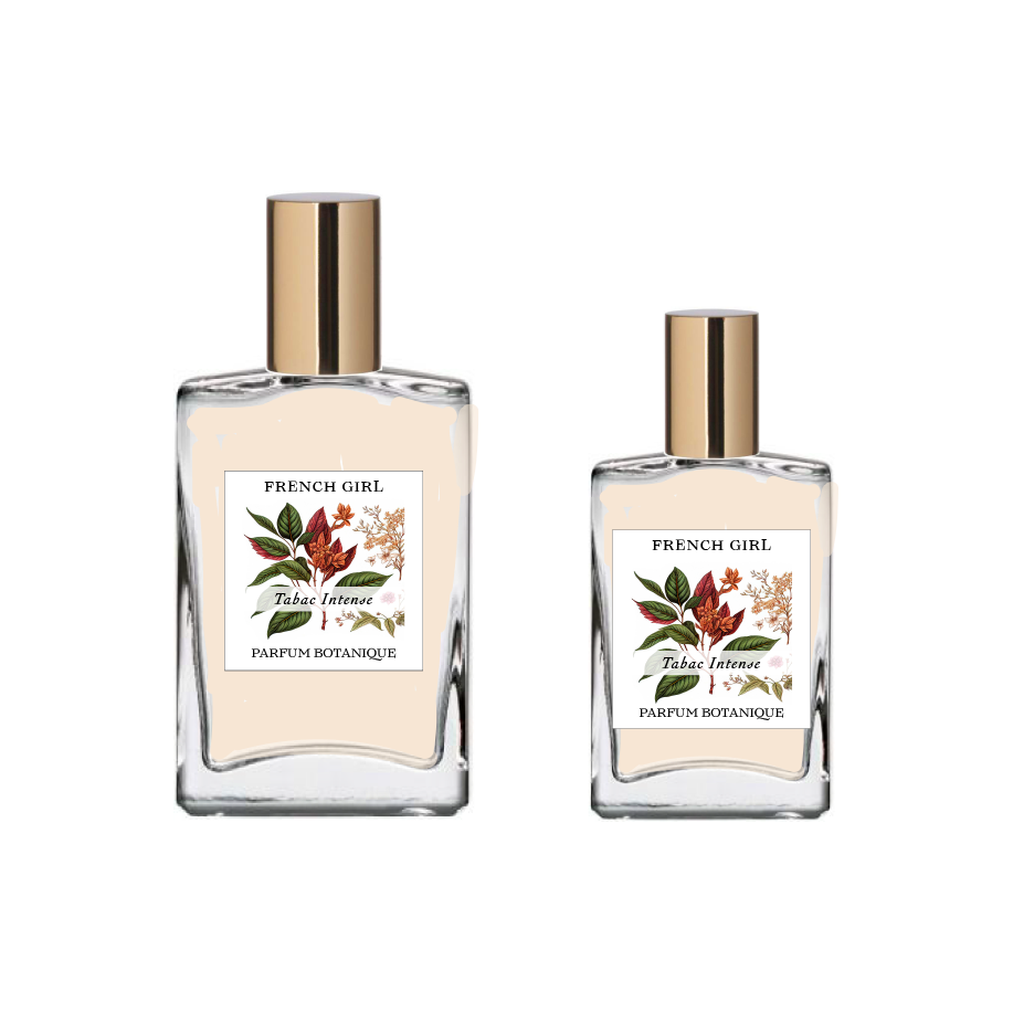 Two glass bottles with gold caps, labeled "FRENCH GIRL Eau Du Tabac Organic Vegan Natural Aromatherapy Perfume," feature floral and leaf designs. These vegan, alcohol-free perfumes from FRENCH GIRL come in two sizes.