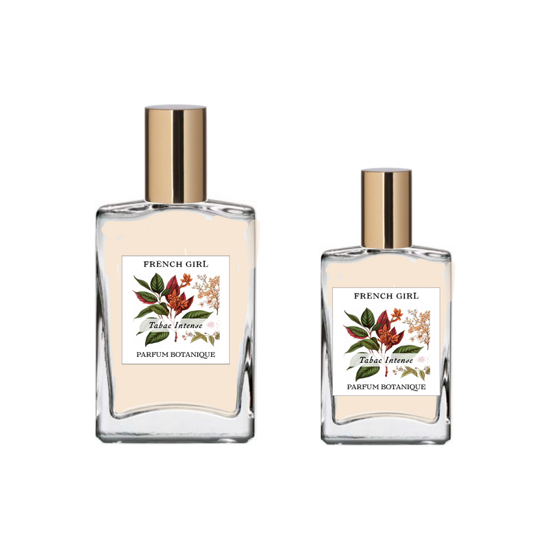 Two glass bottles with gold caps, labeled "FRENCH GIRL Eau Du Tabac Organic Vegan Natural Aromatherapy Perfume," feature floral and leaf designs. These vegan, alcohol-free perfumes from FRENCH GIRL come in two sizes.