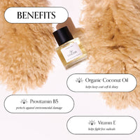 A bottle of Goldie Dog Fragrance-Summer Tonic by Goldie rests on soft, light brown fur, with text bubbles showcasing organic coconut oil, provitamin B5, and vitamin E for a soft, shiny coat—ideal for pups who love natural dog perfume.