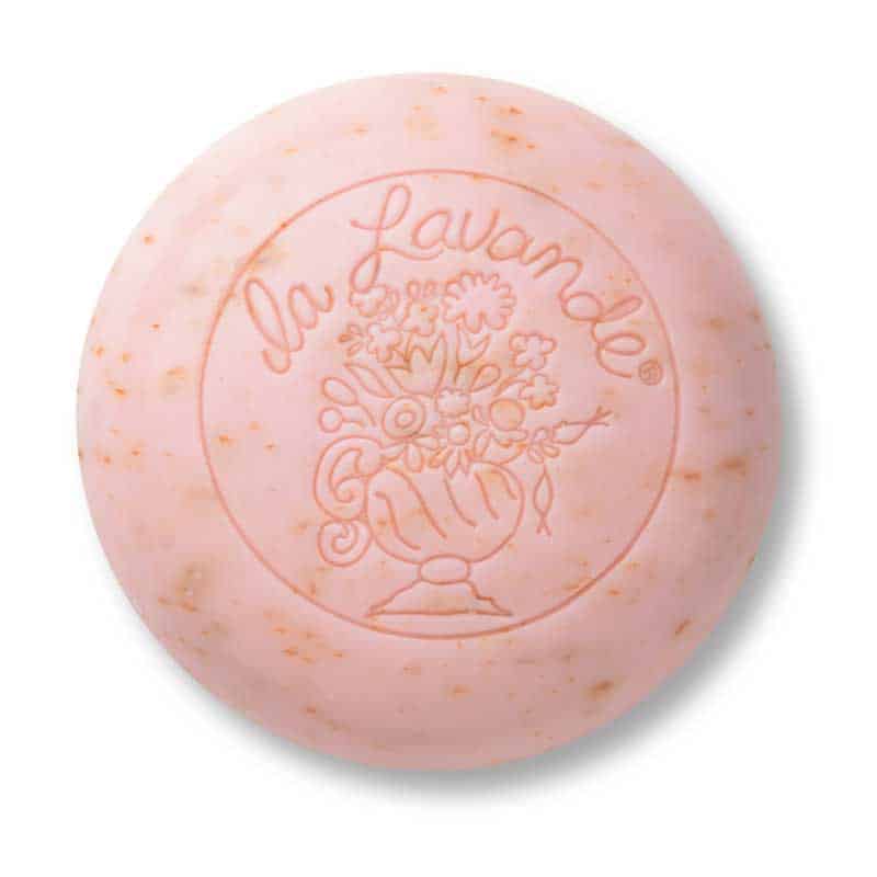 La Lavande Rose Petal Round Hand & Face Soap by La Lavande is a pale pink, triple-milled bar with subtle speckles and an embossed floral design—luxurious for hand and face cleansing.