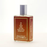 A 50ml rectangular glass perfume bottle labeled "Imaginary Authors Yesterday Haze - Large Size" with a silver cap. The label features a gradient of red and orange with white and yellow text. Notes listed include fig, iris, cream, tonka, tree bark, walnut bitters, and orchard dust—a seductive fragrance by Imaginary Authors.