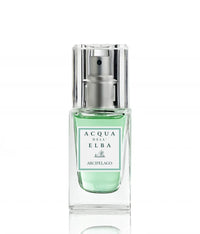 A travel-size 15ml Acqua dell'Elba Arcipelago Uomo EdP features a clear glass bottle with a metallic spray top and green liquid set on a white background. The label showcases the brand and scent name in green and black, inspired by the aromatic essence of the Tuscan Archipelago.