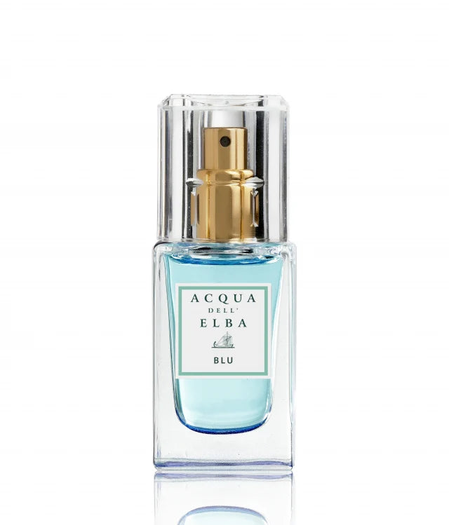 The Acqua dell'Elba Blu Donna EdP Travel Size 15ml, from the renowned brand Acqua dell'Elba, is presented in a clear glass bottle featuring a gold spray nozzle and filled with vibrant blue liquid. Against a white backdrop, this flowery and woody fragrance embodies elegance in every spritz.