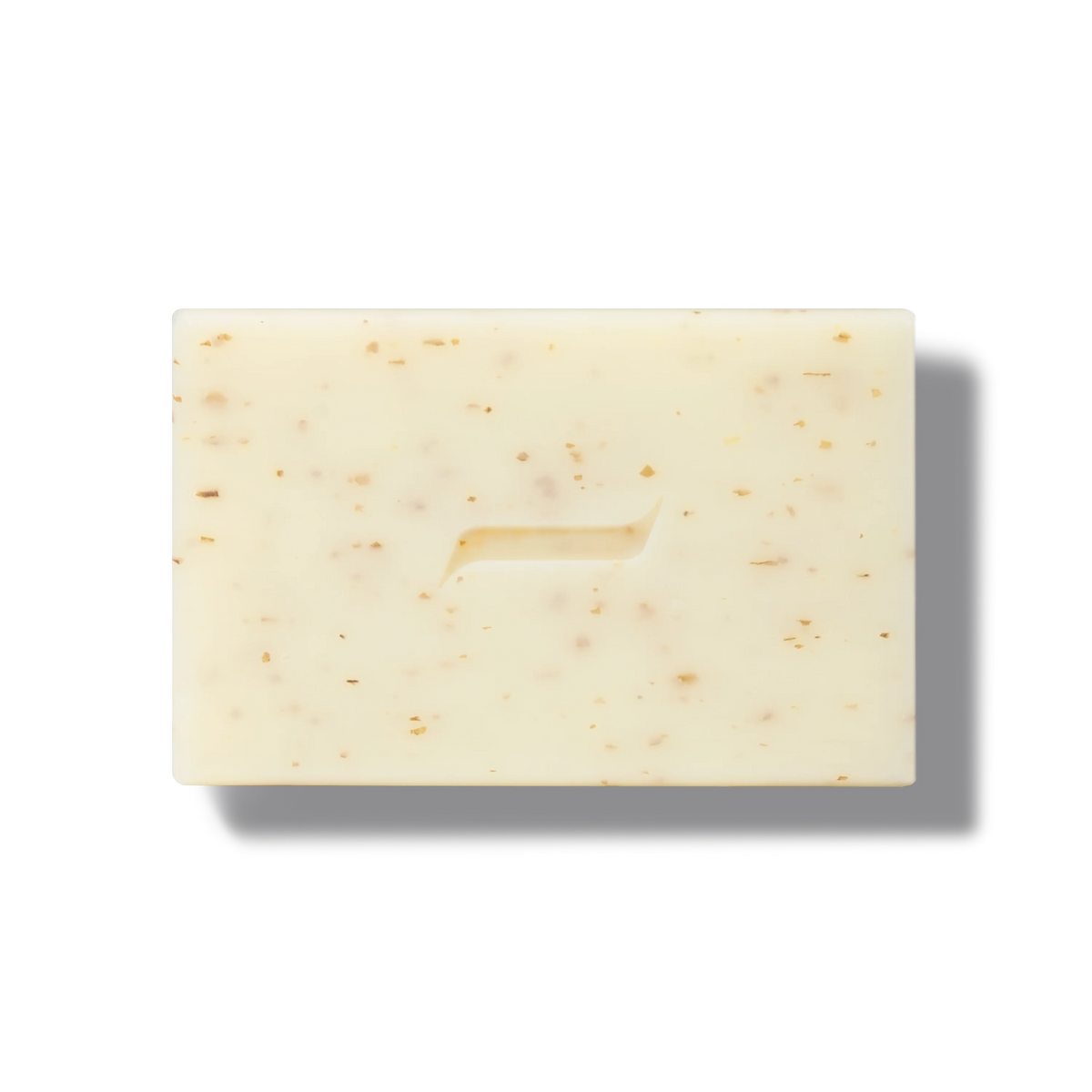 The Caswell-Massey Body Scrub Bar by Caswell Massey is a rectangular, light beige soap with brown flecks and a subtle center groove, displayed on a white background to showcase its natural exfoliating ingredients for gentle cleansing.