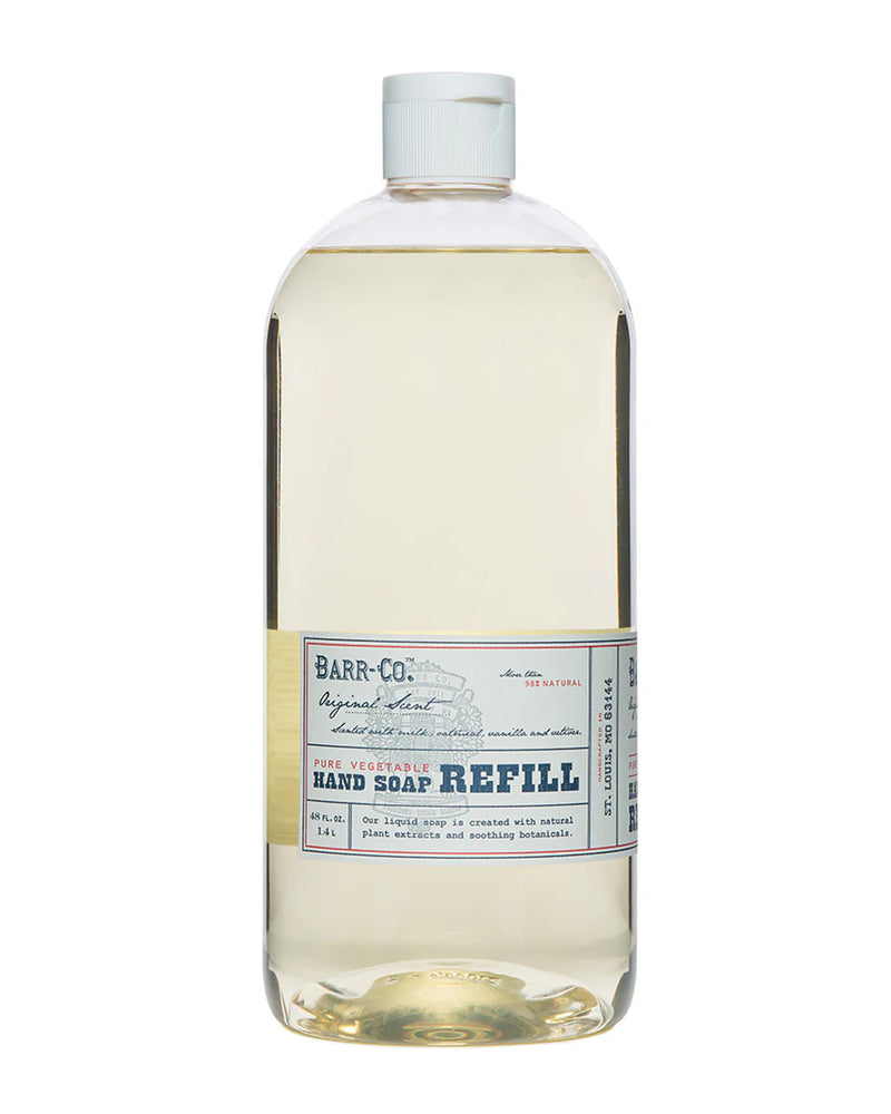 A clear bottle with light yellow liquid labeled "Barr-Co. Original Scent Hand Soap Refill." The white-capped large bottle features blue and beige text highlighting its plant-based formula with a creamy milk oatmeal aroma by Barr-Co.