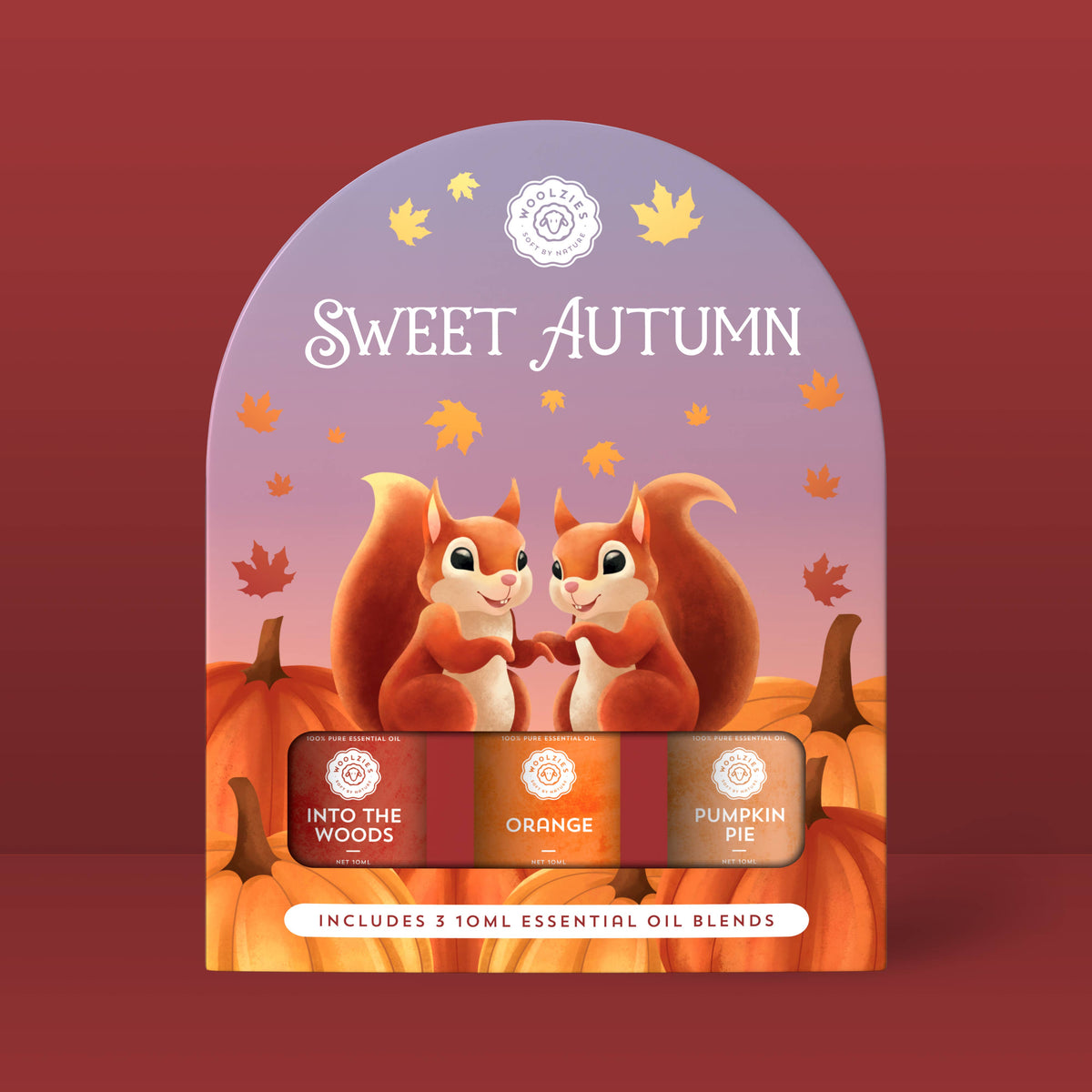 A display of two cartoon squirrels with pumpkins and autumn leaves features the text "Sweet Autumn" and showcases Woolzies’ Sweet Autumn Collection, which includes Into the Woods, Orange, and Pumpkin Pie essential oils.