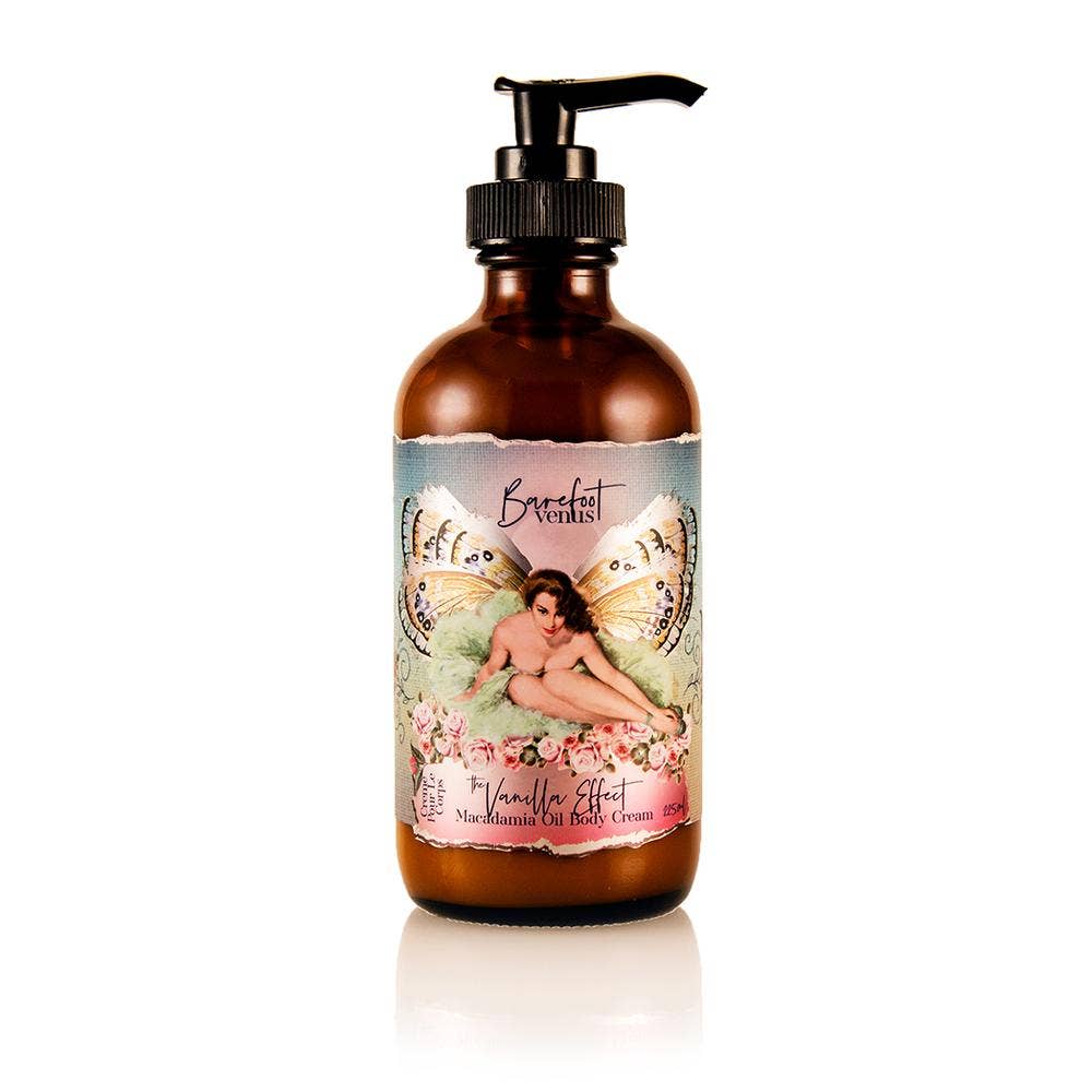 A bottle of Barefoot Venus The Vanilla Effect Body Cream showcases a vintage-inspired label featuring a woman surrounded by floral designs. This cream is infused with vanilla fragrance and comes with a pump dispenser, displaying a warm, brownish hue. It is proudly cruelty-free, adding a caring touch to your skincare routine.