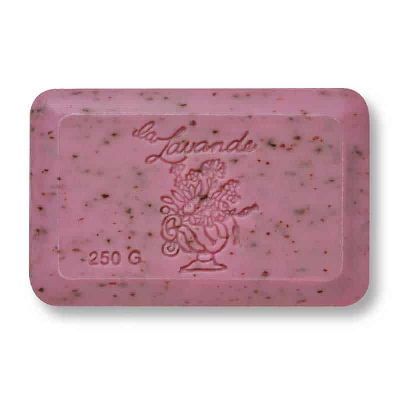 A rectangular bar of pink soap labeled "La Lavande Grenadine French Bath Soap 250g" in a script font, weighing 250 grams. The soap, from the La Lavande brand, is enriched with antioxidant-rich Pomegranate and shea butter. It features a floral bouquet design in the center and small dark specks scattered throughout.