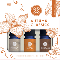 The Woolzies Autumn Classics Collection by Woolzies includes three 10ml bottles of Vanilla, Fall Nights, and Cinnamon essential oils in a box with orange floral designs labeled “100% pure.”.