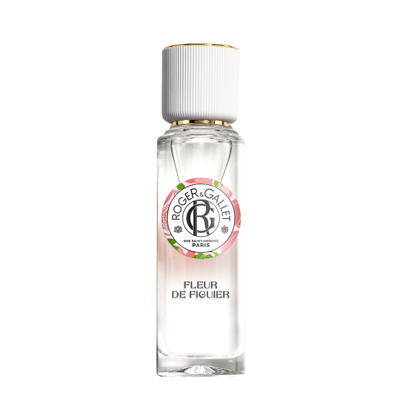 A transparent bottle of Roger & Gallet Fig Blossom fragrant water with a white cap and a pink and green label, isolated on a white background.