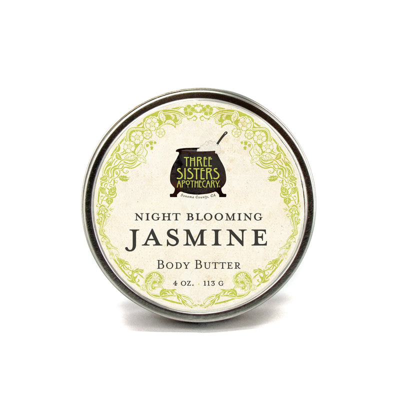 A round tin of Three Sisters Apothecary Night Blooming Jasmin Body Butter, 4 oz, with a decorative green floral label—a natural moisturizer for soft, radiant skin.