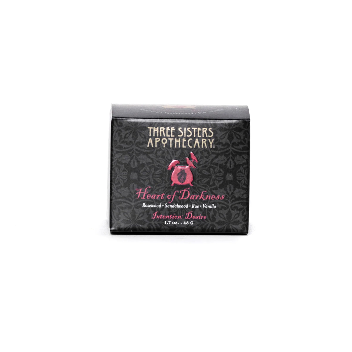 A black box showcases a dark floral pattern, with the text "Three Sisters Apothecary" elegantly embossed in gold at the top. Below, in pink text, it reads "Heart of Darkness Blend," listing ingredients such as Rosewood, Sandalwood, Rum, and Vanilla. The product, named "Three Sisters Apothecary Intentions Body Butter - Heart of Darkness," weighs 1.7 oz (48g).