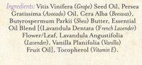 Three Sisters Apothecary Lavender & Mexican Vanilla Lip Soother features ingredients in stylized text, listing both common and scientific names—hydrating essentials like grape seed oil, shea butter, French lavender, vanilla fruit oil, and vitamin E.