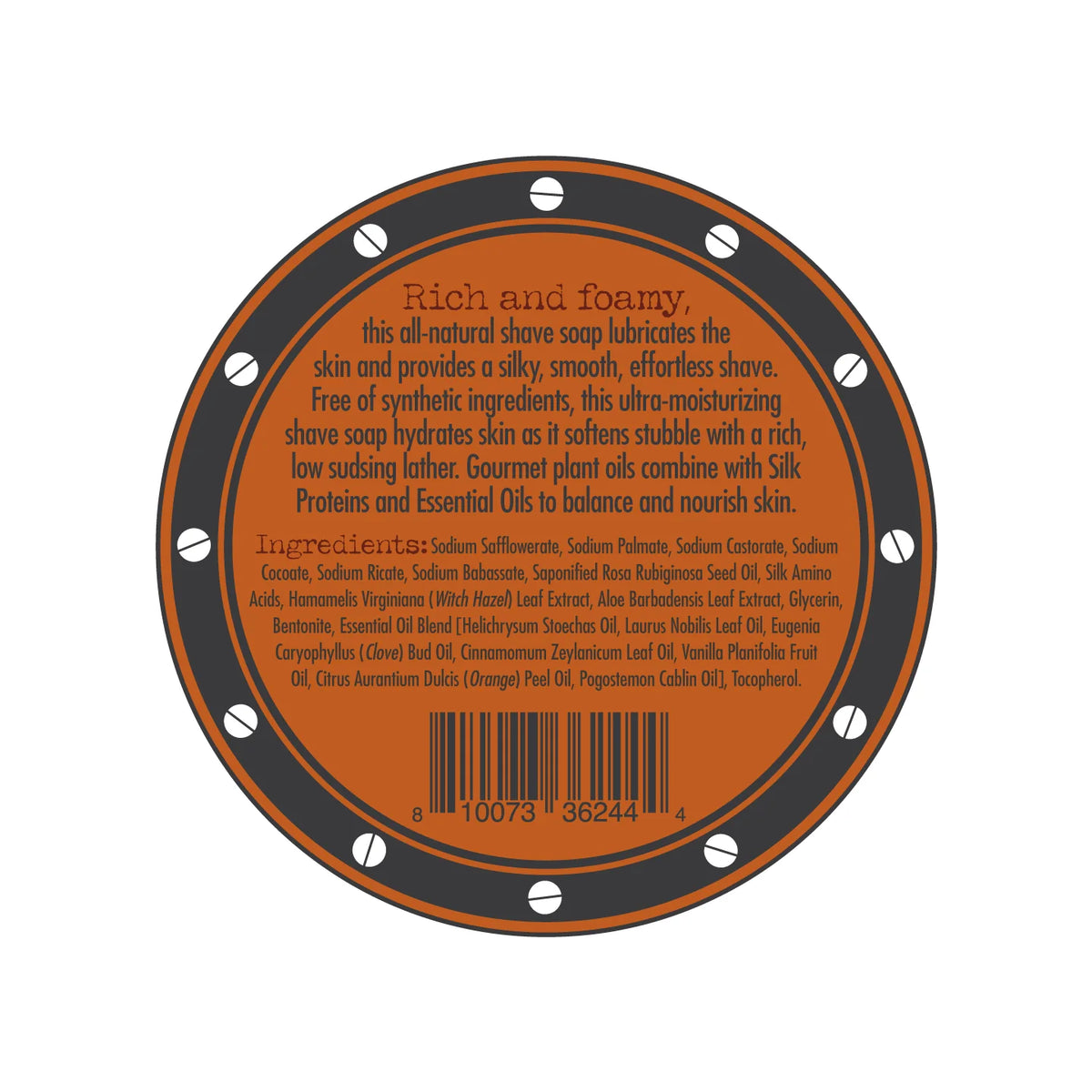 A circular label for the Three Sisters Apothecary Shave Soap - Bay Rum infused with Bay Rum essential oil. The orange label has a brown border adorned with small white circles. It describes the product as rich and foamy, listing ingredients such as nourishing natural oils and extracts. A barcode is positioned at the bottom.