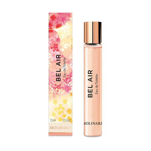 The Molinard Bel Air Eau de Toilet Roll-On features a Grasse floral scent in a 7.5 ml glass bottle with a rose gold cap, housed in a pink, floral-patterned box adorned with vibrant orange and pink designs.