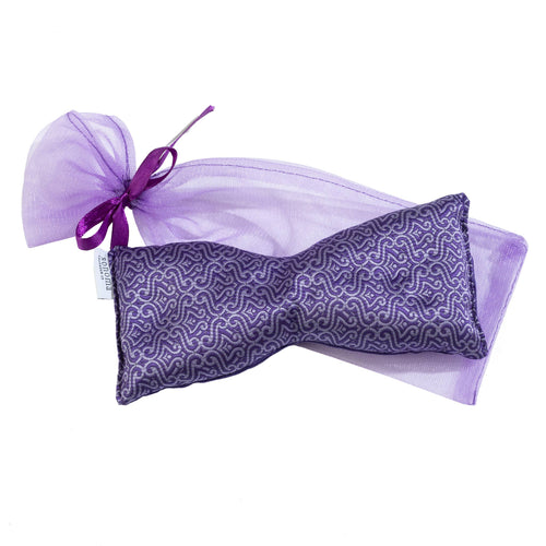 The Sonoma Lavender Eye Pillow - Lavender Persian, crafted by Sonoma Lavender, is filled with soothing lavender and features a purple patterned design that gracefully enhances the silk blend fabric. It comes nestled in a matching sheer drawstring pouch tied with a dark purple ribbon, completing this sophisticated ensemble.