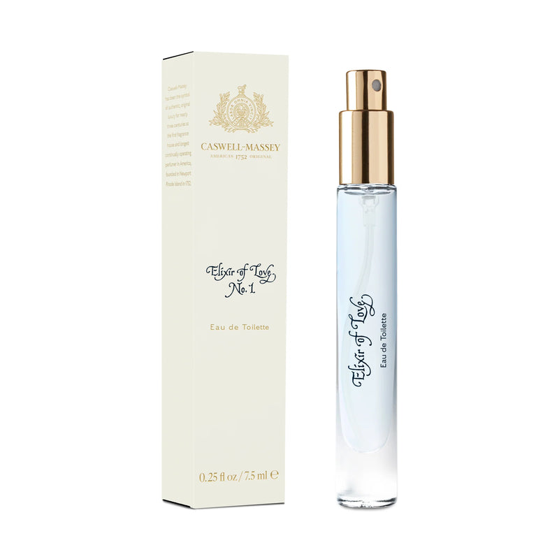A tall, slim bottle of Caswell Massey Elixir of Love Eau de Toilette - 7.5ml, a floral fragrance, next to its elegant cream-colored packaging box adorned with decorative.