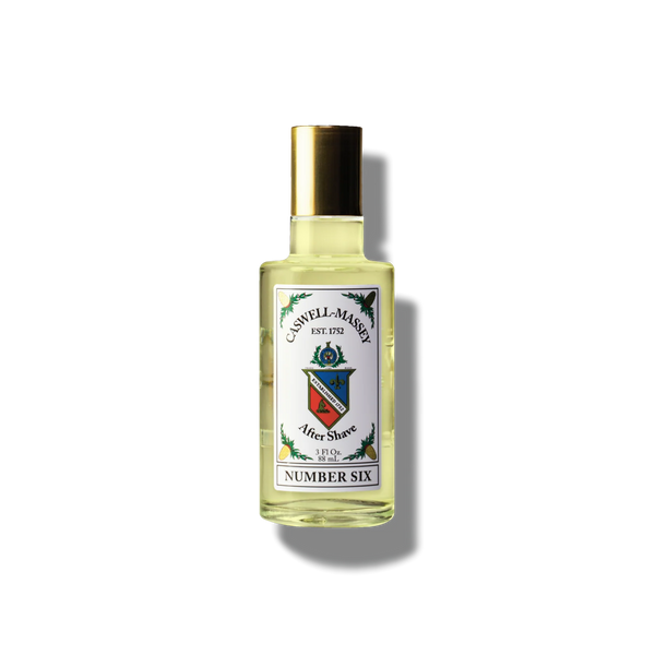 A clear bottle of Caswell-Massey Number Six Aftershave with a gold cap and a label featuring the Caswell-Massey brand crest, displayed against a plain white background.