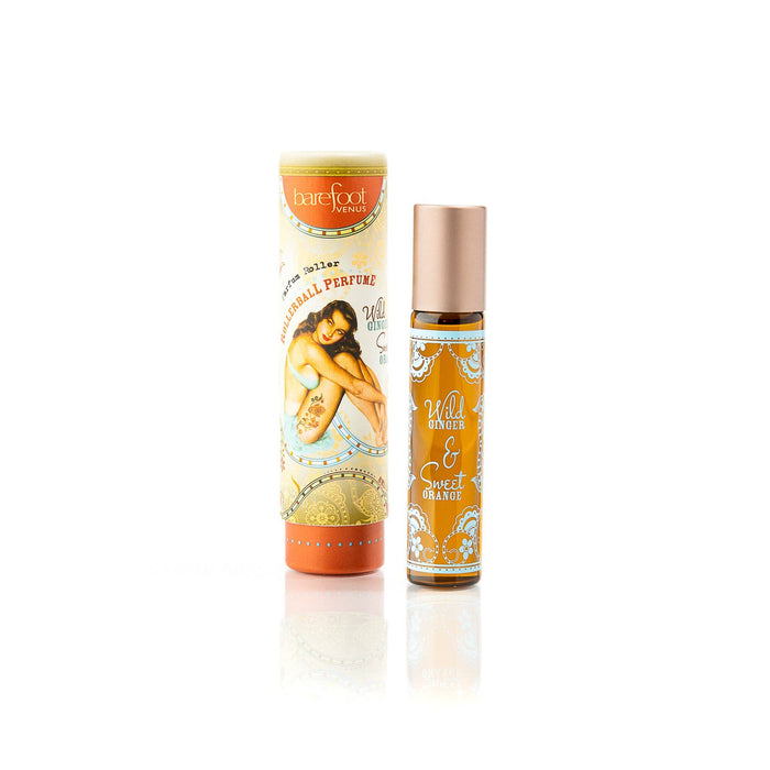 The Barefoot Venus Wild Ginger & Sweet Orange Roll on Perfume features an artistic design with orange and gold accents. Infused with jojoba oil, this natural fragrance provides a vibrant, refreshing experience.
