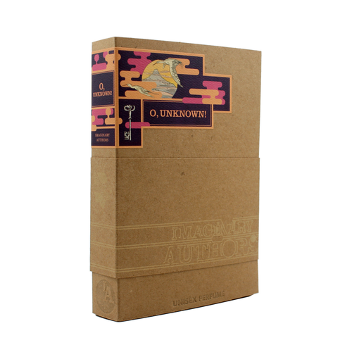 The image shows a travel-size perfume box from Imaginary Authors designed to resemble a hardcover book. The book-like packaging is labeled "O, Unknown!" by Imaginary Authors. It features a cardboard exterior with a decorative spine adorned with colorful patterns, an illustration of a diver, and hints of sandalwood essence.