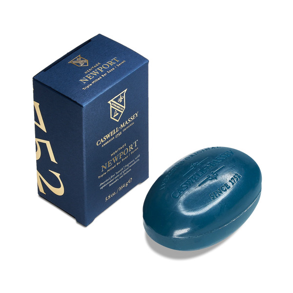 A blue Caswell-MasseyNewport Bar Soap and matching box labeled "Caswell-Massey" rest on a white background, with the triple-milled soap embossed "Since 1752" and evoking a fresh coastal scent.