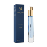 A blue and gold Caswell-Massey Newport Cologne 7.5ml spray bottle stands beside its matching box featuring the brand logo, gold text, and bottle size.