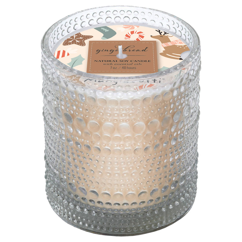 The Boston International Mangiacotti Gingerbread Soy Candle (7 oz) comes in a textured glass jar with a festive gingerbread-themed label—ideal for adding cozy holiday charm to any room.