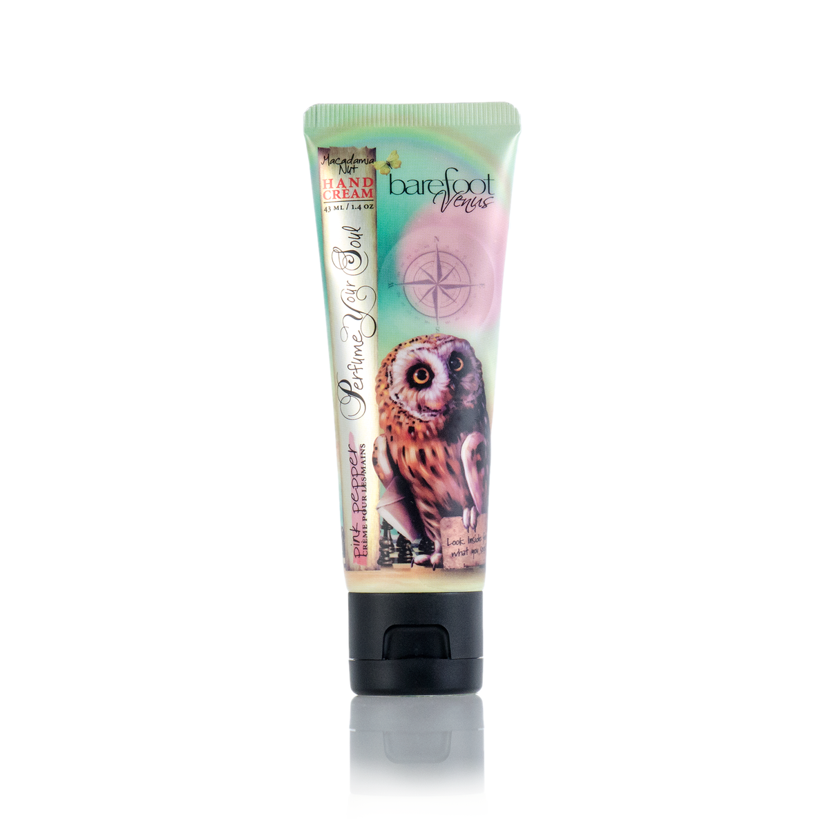 A tube of Barefoot Venus Pink Pepper Hand Cream features an owl illustration on a pastel background with a compass design and text, highlighting its cruelty-free formula enriched with nourishing macadamia nut oil.