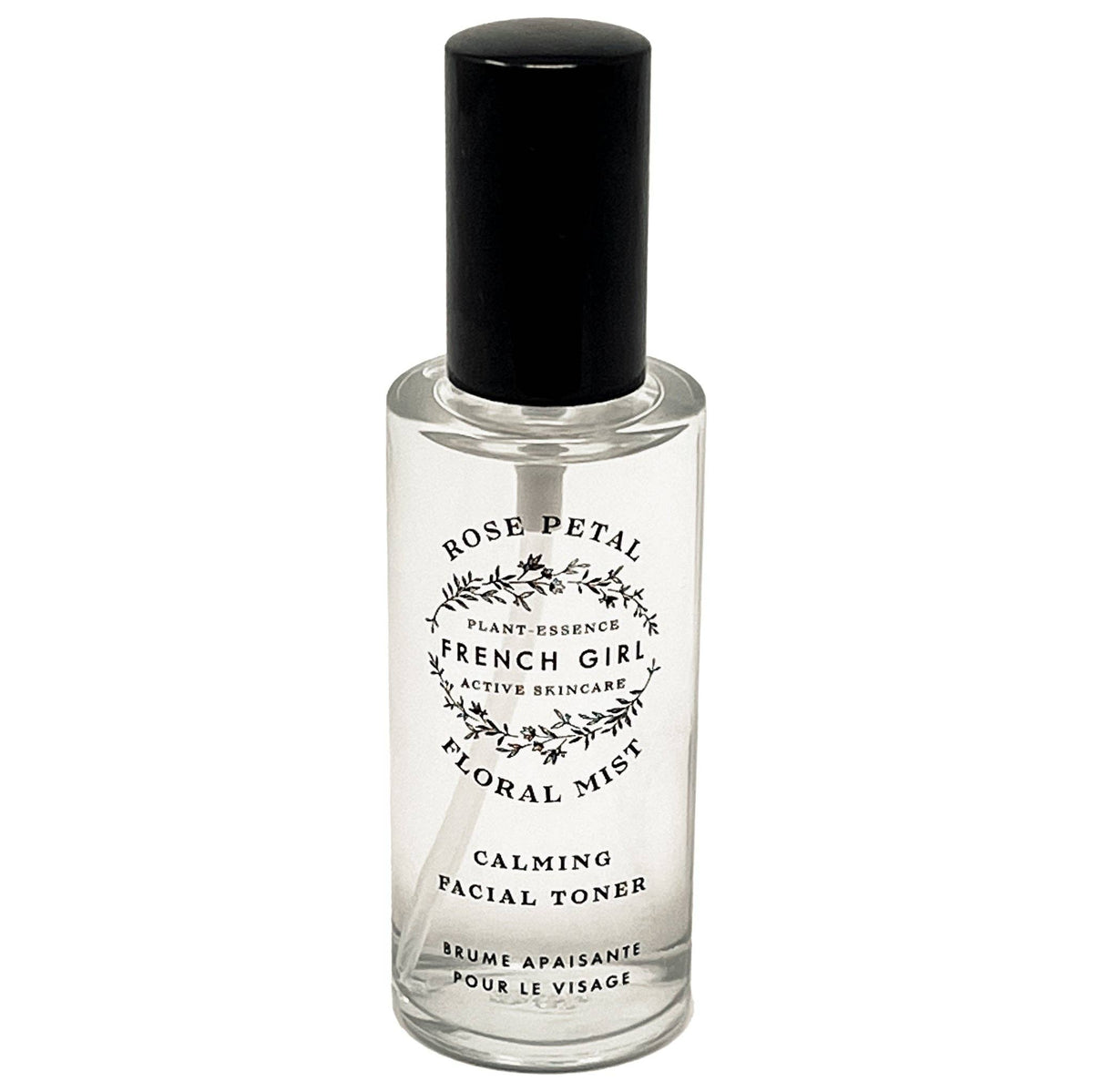 The FRENCH GIRL Organic Floral Face Mist Hydrating Toner - French Rose is a clear glass spray bottle with a black cap and floral design, perfect for organic skincare lovers seeking a refreshing, rose-infused hydrating mist.