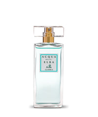 A clear glass bottle of Acqua dell'Elba Classica Donna Eau de Parfum 50ml features a gold spray nozzle, a transparent rectangular cap, and a front label with turquoise border and sailboat graphic, inspired by Mediterranean scents.