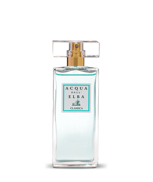 A clear glass bottle of Acqua dell'Elba Classica Donna Eau de Parfum 50ml features a gold spray nozzle, a transparent rectangular cap, and a front label with turquoise border and sailboat graphic, inspired by Mediterranean scents.
