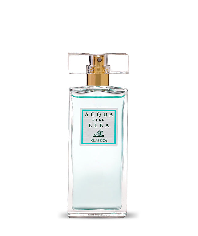 A clear glass bottle of Acqua dell'Elba Classica Donna Eau de Parfum 50ml features a gold spray nozzle, a transparent rectangular cap, and a front label with turquoise border and sailboat graphic, inspired by Mediterranean scents.