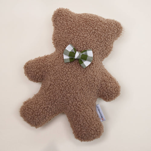The MODERNBEAST Modernbeast Lavender Teddy Bear with Bowties is a soft, brown plush toy featuring a green and white checkered bow tie and fabric tag—an ideal, soothing companion for cozy moments on any plain, light surface.