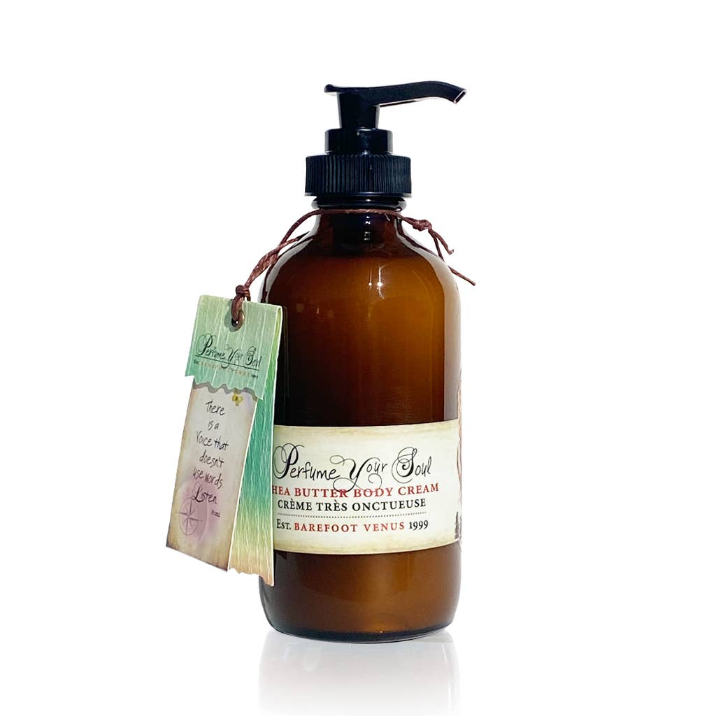 Amber pump bottle labeled "Barefoot Venus Pink Pepper Body Cream" by Barefoot Venus, enriched with shea butter and macadamia nut oil. A handwritten tag around the neck reads, "There is no time to be bored in a world as beautiful as this.