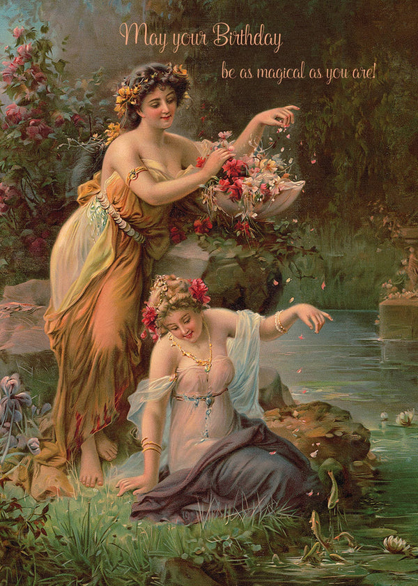 Two women in flowing dresses and flower crowns gather petals by a pond in a lush garden. "May your birthday be as magical as you are!" A Portland-made, eco-friendly birthday card by P. Flynn Design / Phun House.