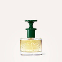 A clear 60mL Caswell-Massey Rose Perfume bottle with embossed details contains light yellow liquid and features a distinctive green nozzle cap, set against a plain light background.