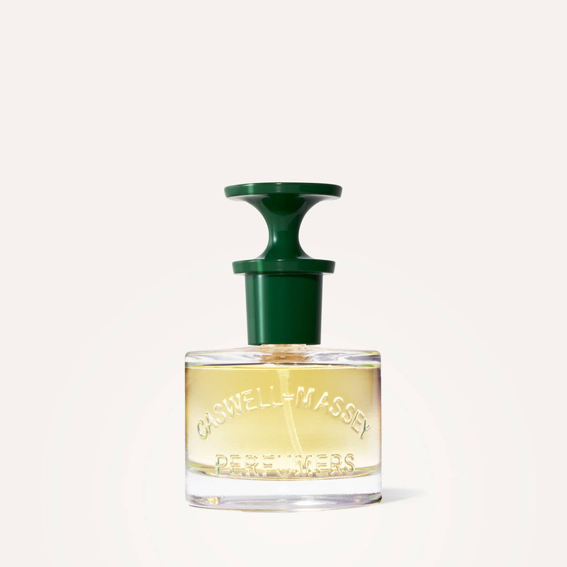 A clear 60mL Caswell-Massey Rose Perfume bottle with embossed details contains light yellow liquid and features a distinctive green nozzle cap, set against a plain light background.