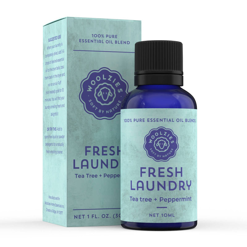Woolzies Fresh Laundry Essential Oil by Woolzies comes in a 10 ml blue bottle and box labeled "Tea tree + Peppermint." Perfect for dryer balls, it provides a long-lasting scent and features a light blue package with a circular logo.