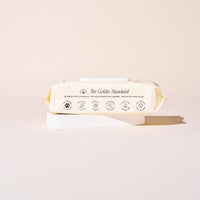 A light beige pack of Goldie - So Fresh, So Clean Probiotic Wipes by Goldie rests on a white block against a pale background, with icons and text on the packaging highlighting its hypoallergenic and probiotic features.