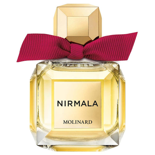 A clear glass bottle of Molinard Nirmala Eau de Parfum by Molinard, featuring a gold cap and a bold red bow at the neck, filled with an exotic golden floral fragrance.